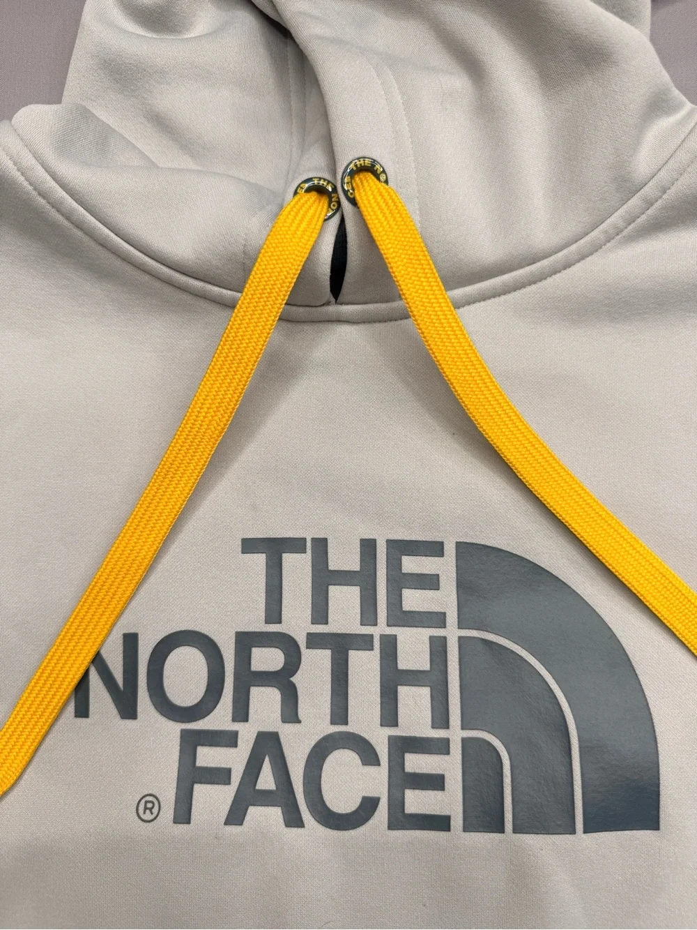 The North Face Men's Light Gray Crewneck Hoodie with Yellow Drawcords